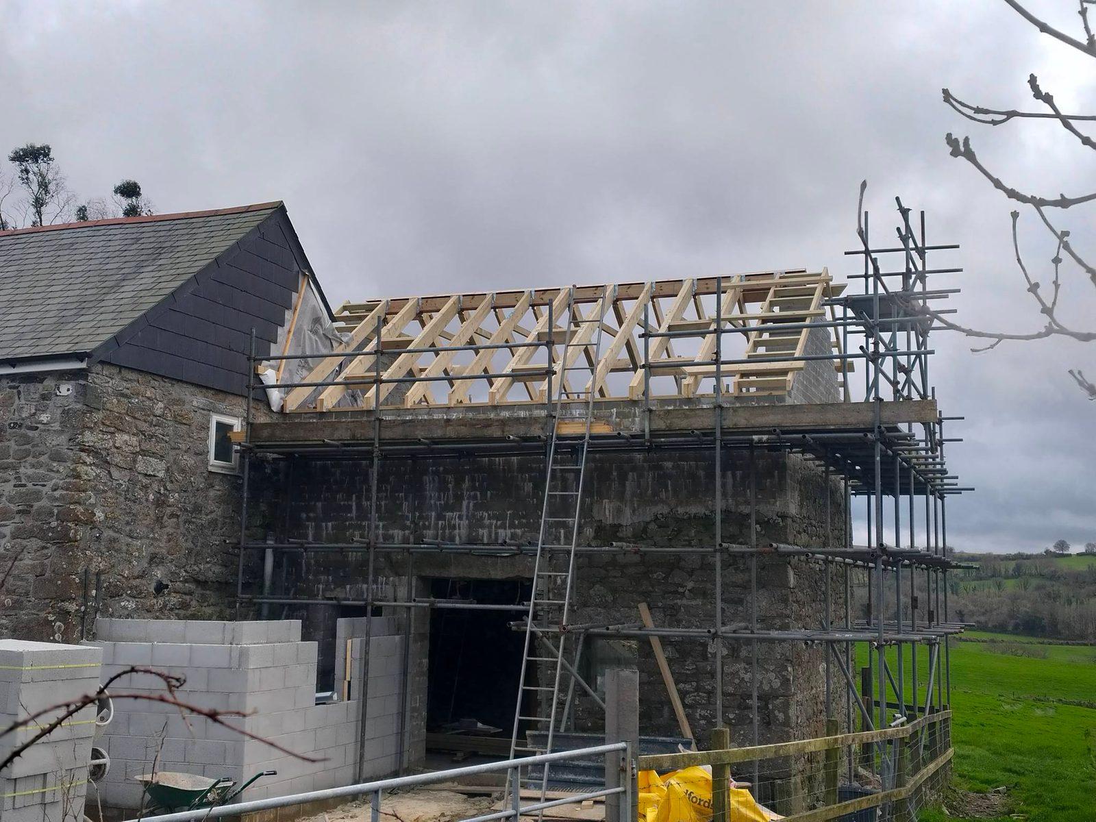 Modern rear extension with full-height glazing and slate roof