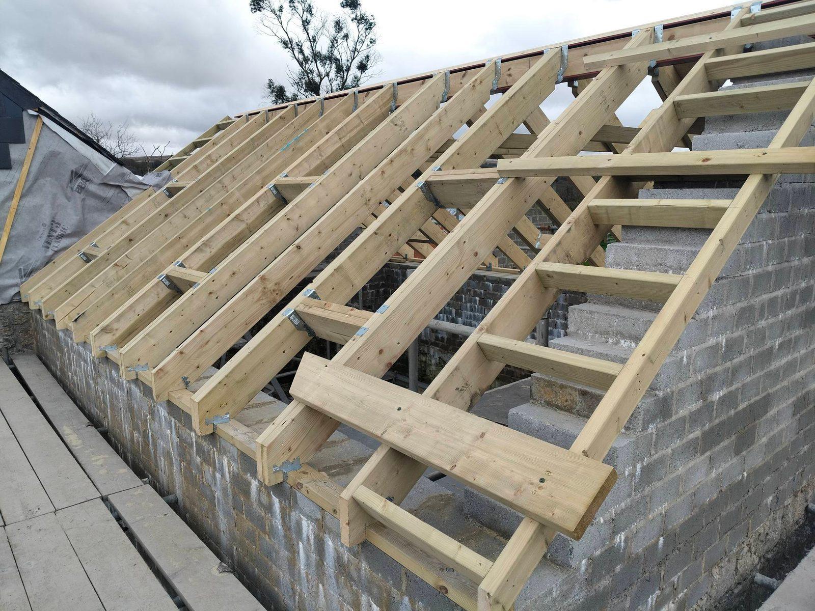 Newly framed pitched timber roof on a rural building