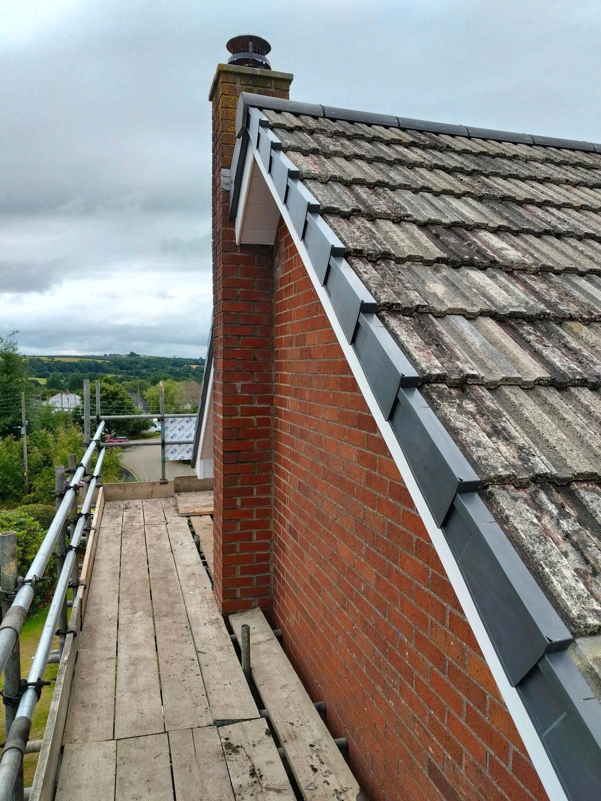 Fresh leadwork and verge detail on a tiled roof